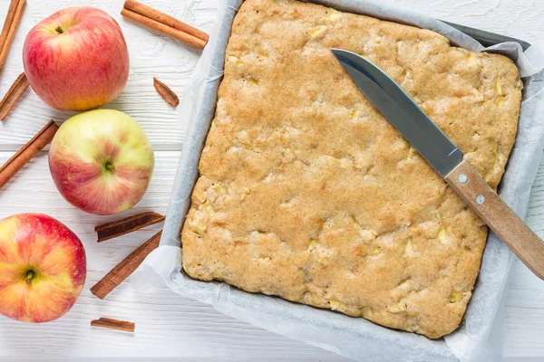 Homemade blondie brownies apple cake in baking dish, top view — Stock Photo, Image