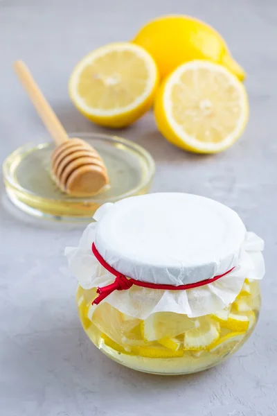 Lemon and honey mix for citrus tea in glass jar — Stock Photo, Image