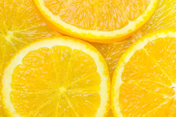Tranches d'oranges juteuses de près — Photo