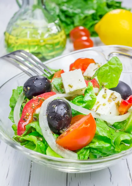 Greek salad in a glass bowl closeup — Stock Photo, Image