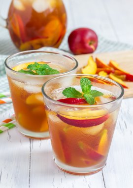 Two glasses of refreshing homemade nectarine iced tea