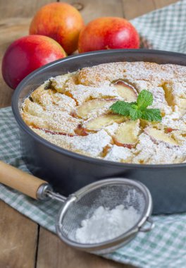 Peach clafoutis in a baking dish