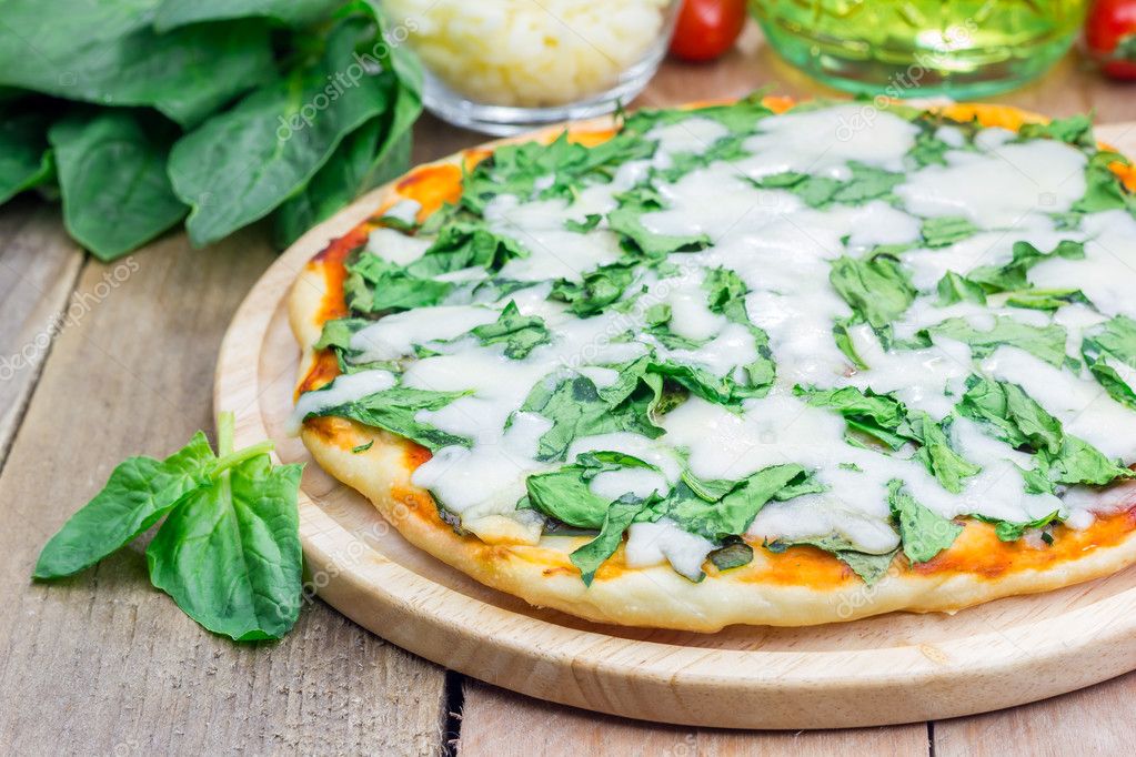 Homemade cheese spinach pizza