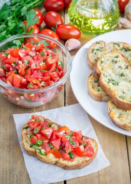 Bruschetta domates, otlar ve kızarmış sarımsak peynir ekmek üzeri yağlıboya