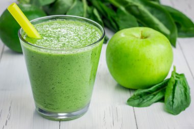 Healthy smoothie with green apple, spinach, lime and coconut milk  clipart