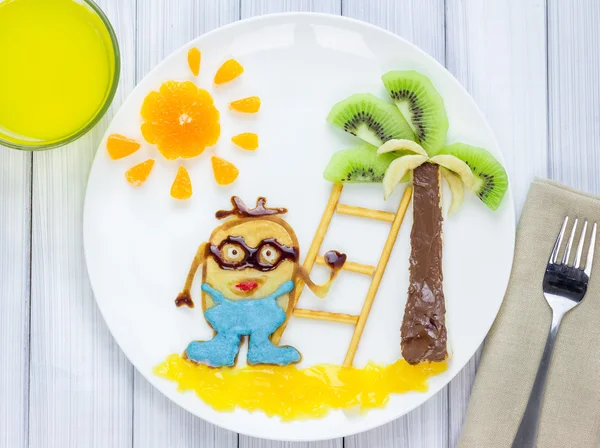 Children breakfast with pancakes and fruits. Food art. Cartoon hero. — Stock Photo, Image