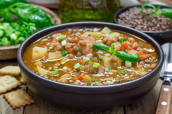 Homemade soup with lentils and sausages