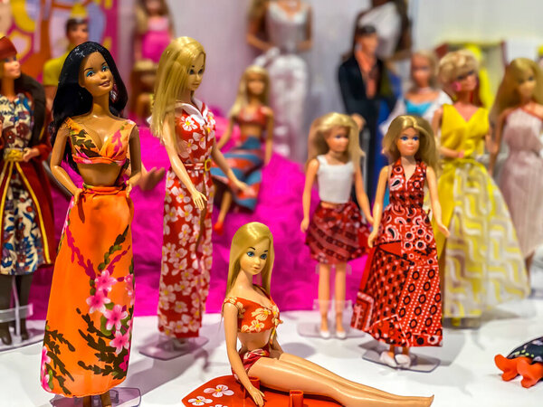 Darmstadt, Germany - September 16th 2020: A german photographer visiting Loop5, the biggest shopping mall in Hesse, taking pictures of an exhibition with different barbie dolls from 30 decades.