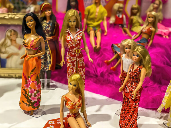 Darmstadt, Germany - September 16th 2020: A german photographer visiting Loop5, the biggest shopping mall in Hesse, taking pictures of an exhibition with different barbie dolls from 30 decades.