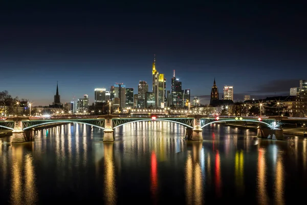 The skyline of Frankfurt at night at a cold day in winter.