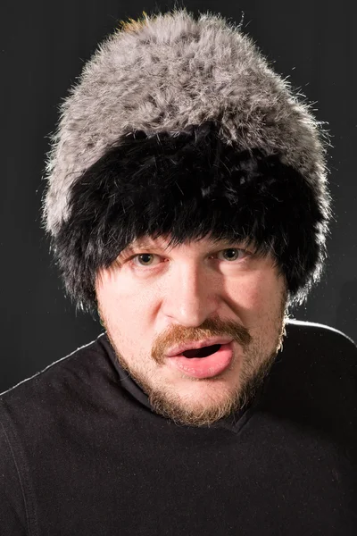 Portrait of a man in fur hat — Stok Foto