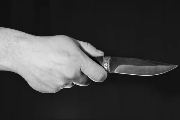 Mans hand holding knife — Stock Photo, Image