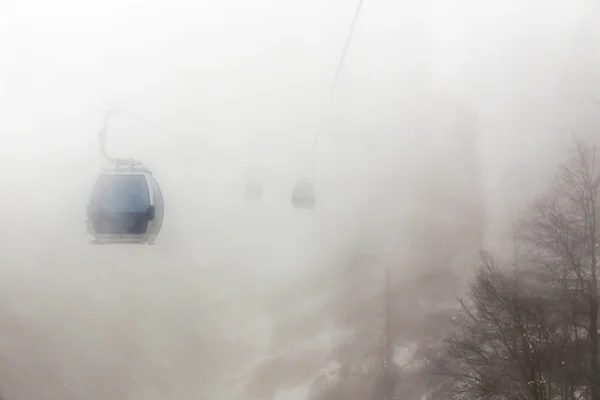 Ski elevator cabin in the mis — Stock Photo, Image