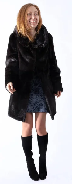 Pretty young woman dressed in fur coat — Stock Photo, Image