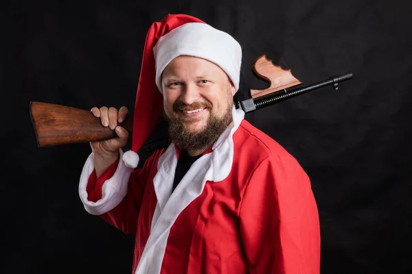 Веселий Санта з портретом студії кулемета — стокове фото