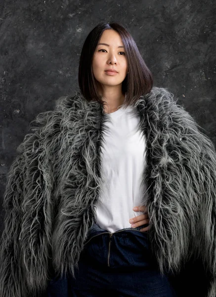 Beautiful korean woman dressed in fur mantle