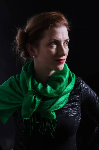 Beautiful lady in neckerchief studio portrait on black background. — Stock Photo, Image