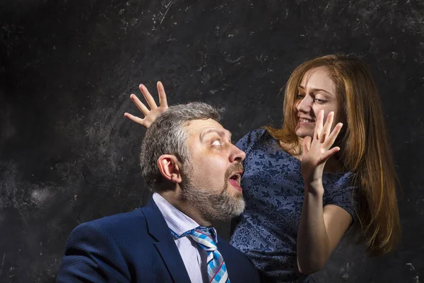 Bearded man and young woman, happy couple studio portrait. — Stock Photo, Image