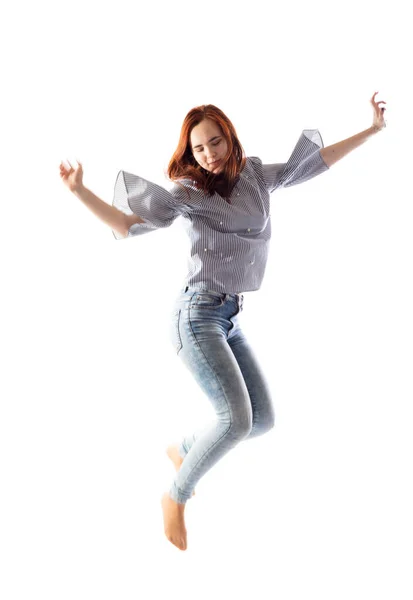 Teenage long hair girl jumping on white background. — Stock Photo, Image