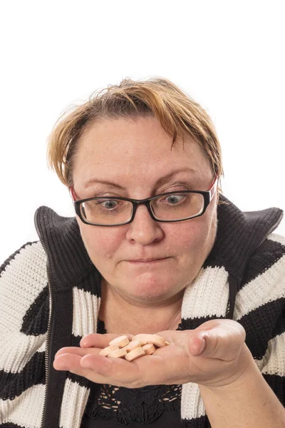 Middle aged housewife offers the tablets studio emotional portrait — Stock Photo, Image