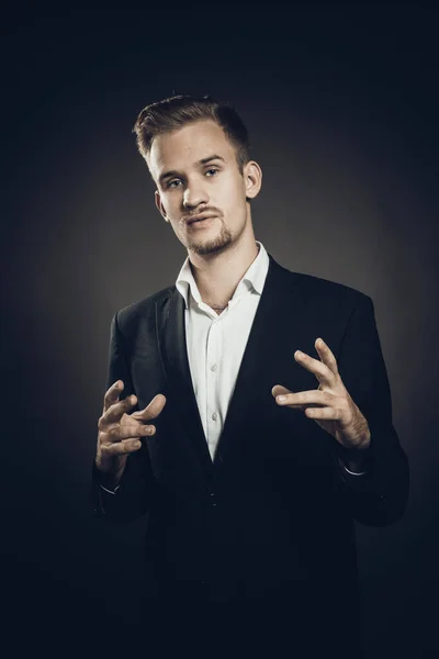 Young man dressed in suit studio portrait — Stock Photo, Image