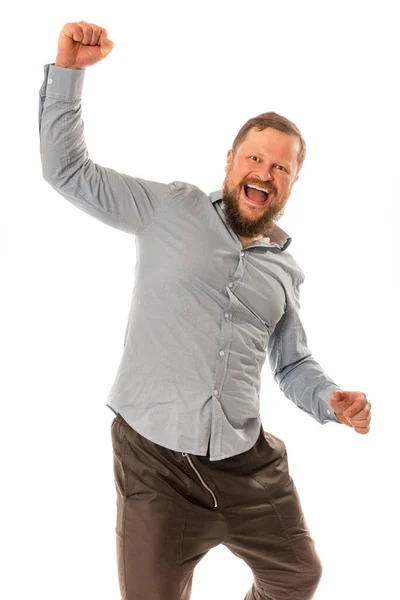 Gioioso uomo barbuto in camicia è felice di vincere — Foto Stock