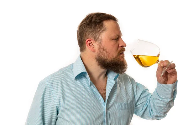 Solid bearded man in shirt tasting whisky studio portrait — Stock Photo, Image
