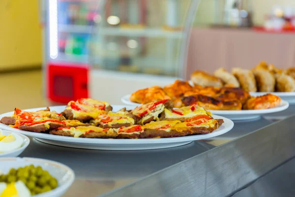 Served tasty meal on plate in restaurant close up view — Stock Photo, Image