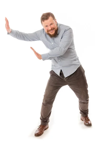 Joyful bearded man in shirt pushing invisible wall — Stock Photo, Image