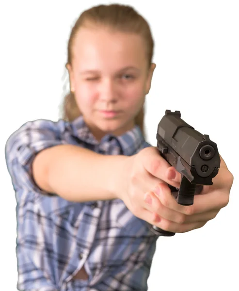 Menina adolescente apontando a partir da arma isolada no branco — Fotografia de Stock