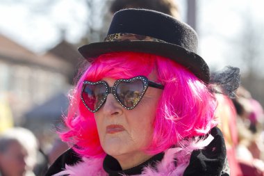 OLDENZAAL, NETHERLANDS - MARCH 6, 2011: People in colourful carnival dress during the annual carnival parade  in Oldenzaal, Netherlands.