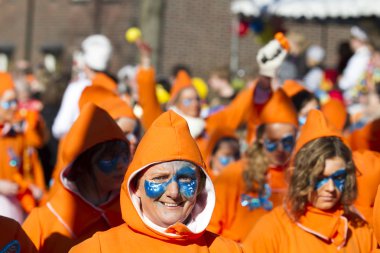 OLDENZAAL, NETHERLANDS - MARCH 6, 2011: People in colourful carnival dress during the annual carnival parade  in Oldenzaal, Netherlands.