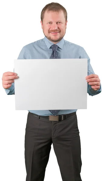 Middle-aged businessman standing with blank list of paper on white background — Stock Photo, Image