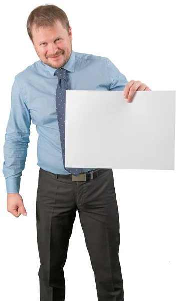 Middle-aged businessman standing with blank list of paper on white background — Stock Photo, Image