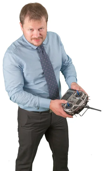 Man with flight remote controller in hands close up view on white background — Stock Photo, Image