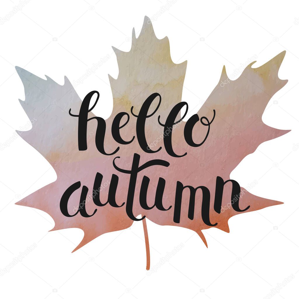 Hand drawn lettering Hello Autumn on maple leaf. 