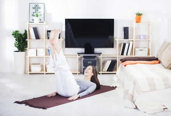 Woman is doing fitness at home