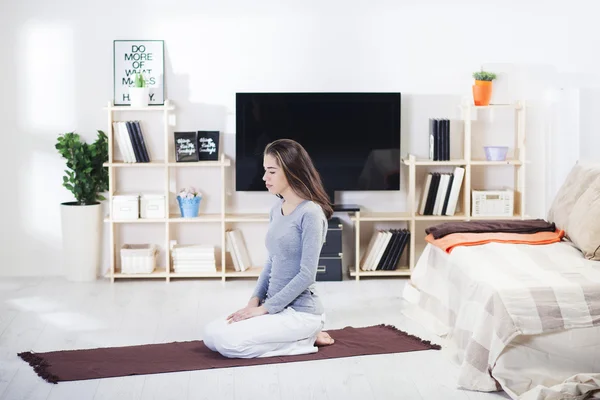 Woman is doing fitness at home