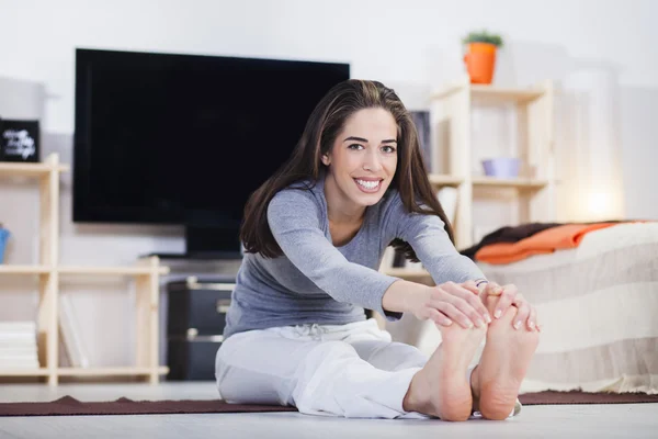 Woman is doing fitness at home