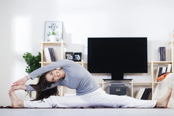 Woman is doing fitness at home