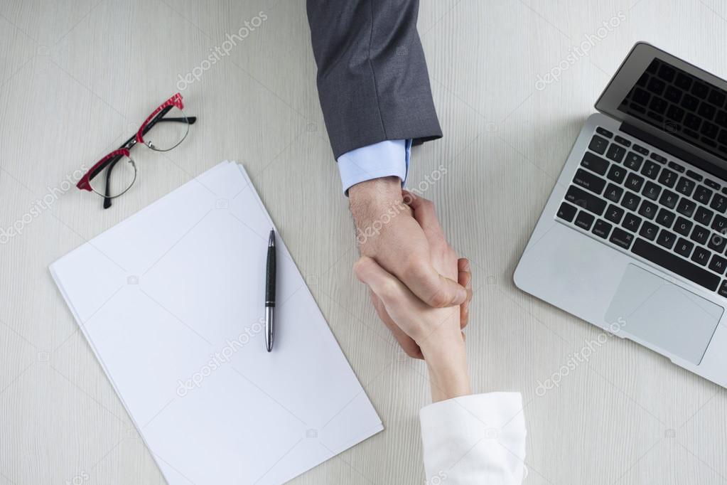businessman and businesswoman hands holding