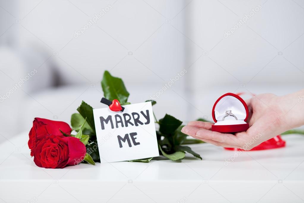Red rose with note MARRY ME