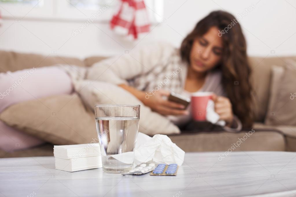 Sick woman drinking tea