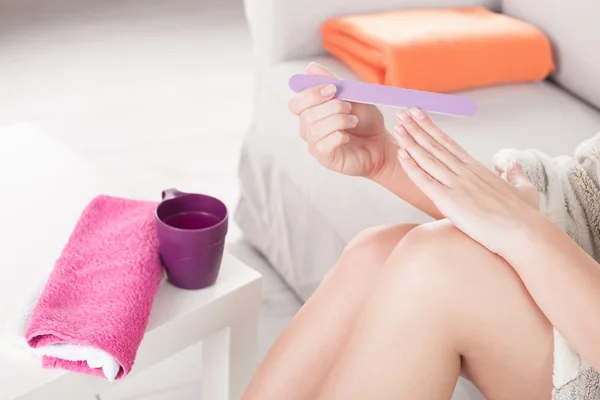 Woman doing manicure and pedicure — Stock Photo, Image