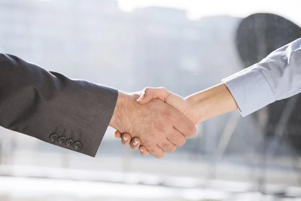 Business handshake between woman and man — Stock Photo, Image