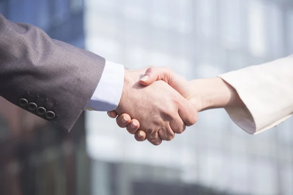 Business handshake between woman and man — Stock Photo, Image