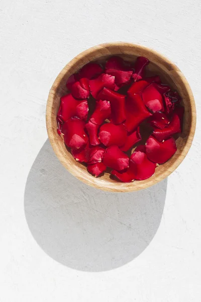Red rose petals in bowl