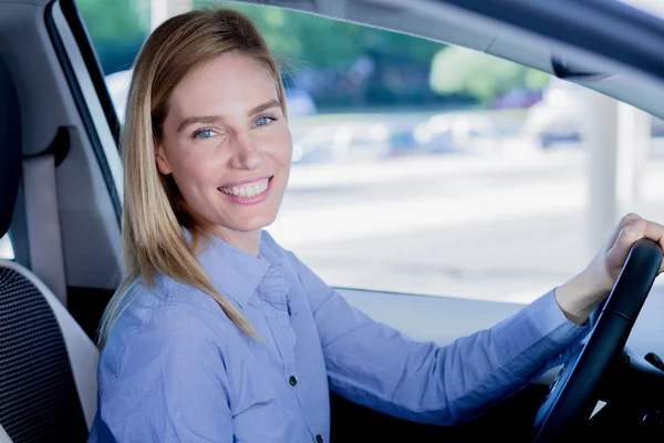 Beautiful young woman in car Royalty Free Stock Images