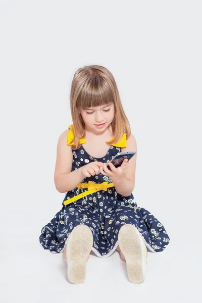 Girl using mobile phone isolated — Stock Photo, Image