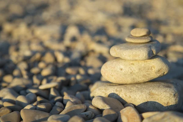 Stones and rocks balance on the beach